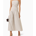 Woman wearing beige and white striped strapless midi dress with pleated skirt — Anna Quan | Endless UAE
