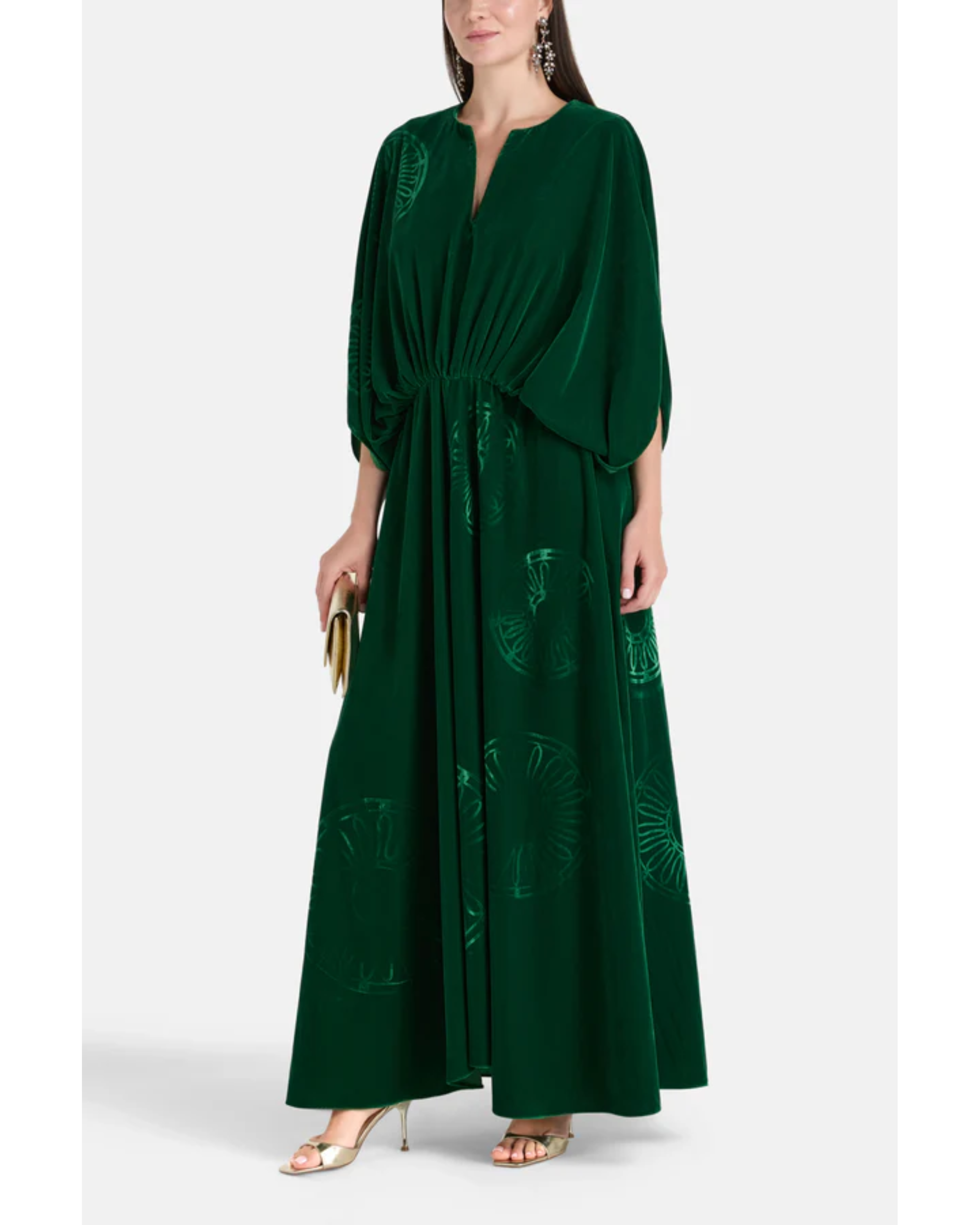 Woman wearing a forest green silk velvet maxi dress with draped sleeves and embroidered details — Themis-Z | Endless UAE