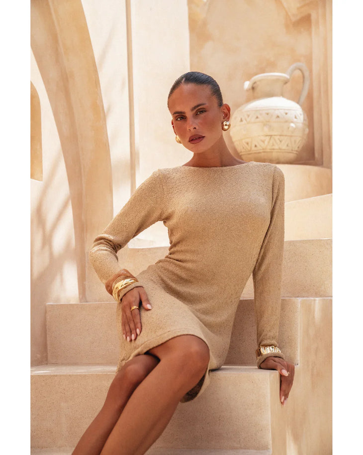 Pregnant woman wearing beige long-sleeve Yasmin Dress with ruched cuffs — Miharo | Endless UAE