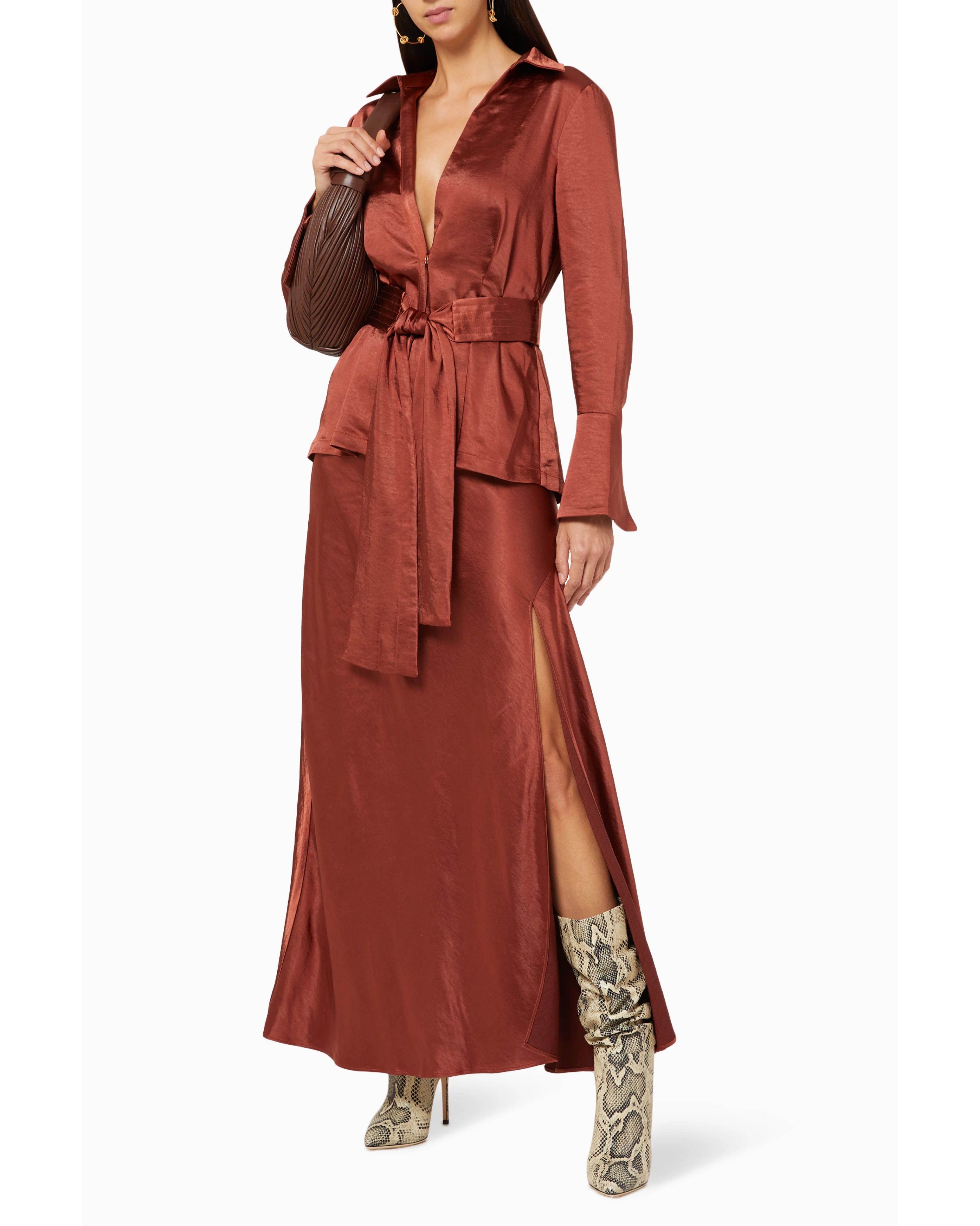 Rust satin blouse with plunging neckline and self-tie belt worn with matching maxi skirt and snakeskin boots — Significant Other | Endless UAE