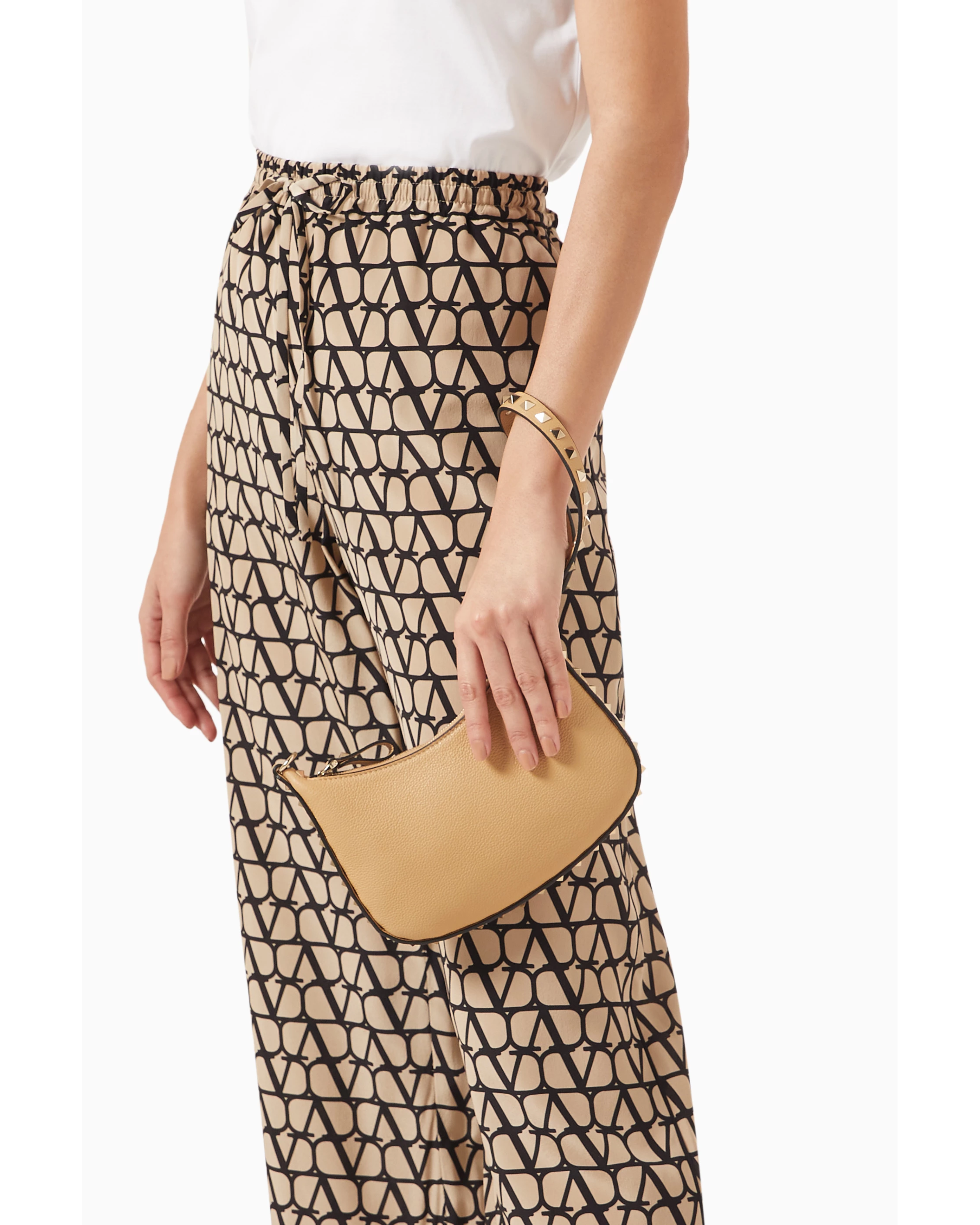 Beige leather mini hobo shoulder bag with dark brown studded trim and single strap — Valentino Garavani | Endless UAE