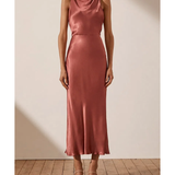 Woman wearing rust-colored high neck bias midi dress with strappy heels — Shona Joy | Endless UAE