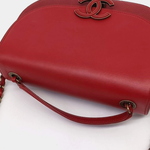 Red leather curved messenger bag with interlocking CC logo detail — Chanel | Endless UAE