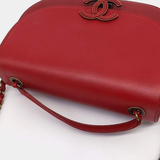 Red leather curved messenger bag with interlocking CC logo detail — Chanel | Endless UAE