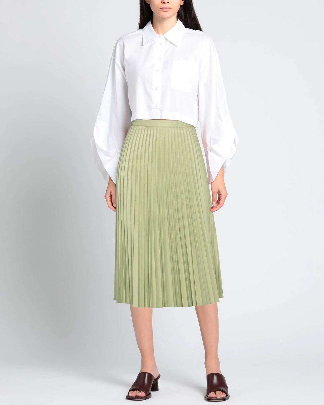 Pleated sage green midi skirt styled with crisp white shirt and brown mules — Proenza Schouler | Endless UAE