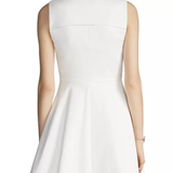 White sleeveless fit-and-flare mini dress with back yoke detail, shown from rear view — Maje | Endless UAE