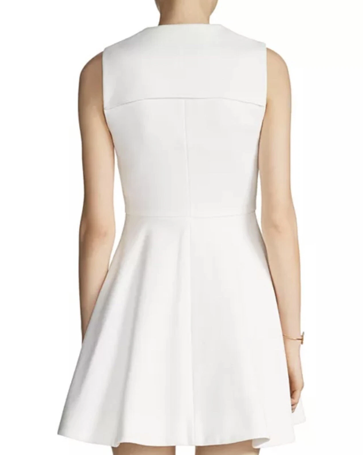 White sleeveless fit-and-flare mini dress with back yoke detail, shown from rear view — Maje | Endless UAE