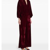 Woman wearing burgundy silk velvet jumpsuit with ornamental detailing and wide legs — Themis-Z | Endless UAE