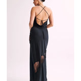 Woman wearing black satin maxi dress with lace side detail and halter neckline — Meshki | Endless UAE