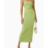 Woman wearing lime green strapless midi dress with ruched waist and white sandals — Bec & Bridge | Endless UAE