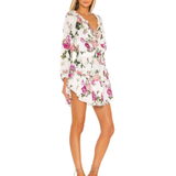White floral print mini dress with long sleeves, ruffled hem, and V-neckline on model — Love Shack Fancy | Endless UAE