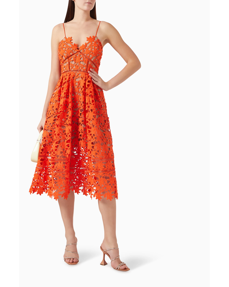Woman wearing vibrant orange lace midi dress with thin straps and cutout details — Self-Portrait | Endless UAE