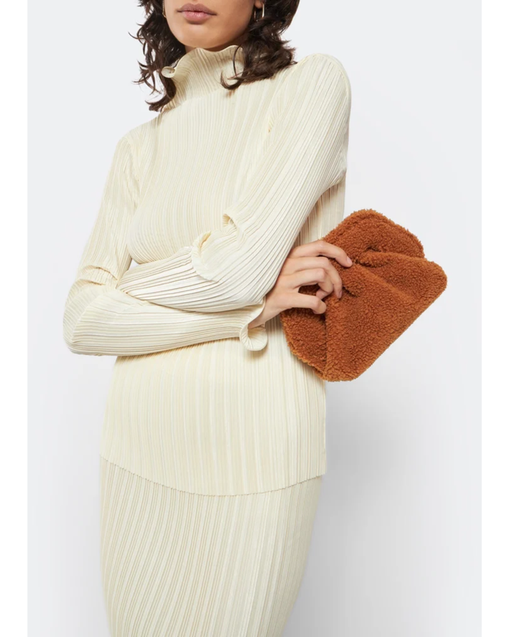 Gea Clutch in caramel brown textured fabric held in hand — TheMoire | Endless UAE