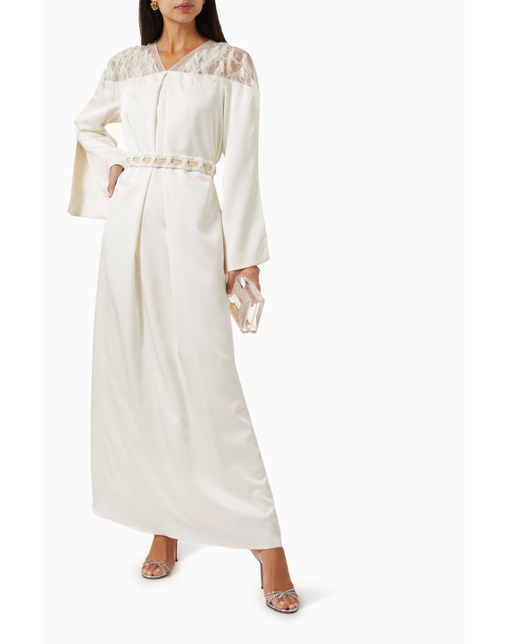 Elegant ivory maxi dress with lace shoulder detail, braided belt at waist, and long sleeves — Nass | Endless UAE