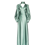 Woman in deep sea foam silky bias-cut gown with draped sleeve detail — Vasiliki | Endless UAE