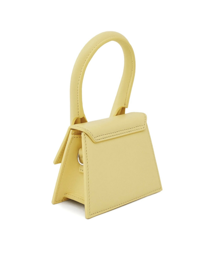 Pale yellow mini handbag with curved top handle and contrasting stitching detail — Jacquemus | Endless UAE