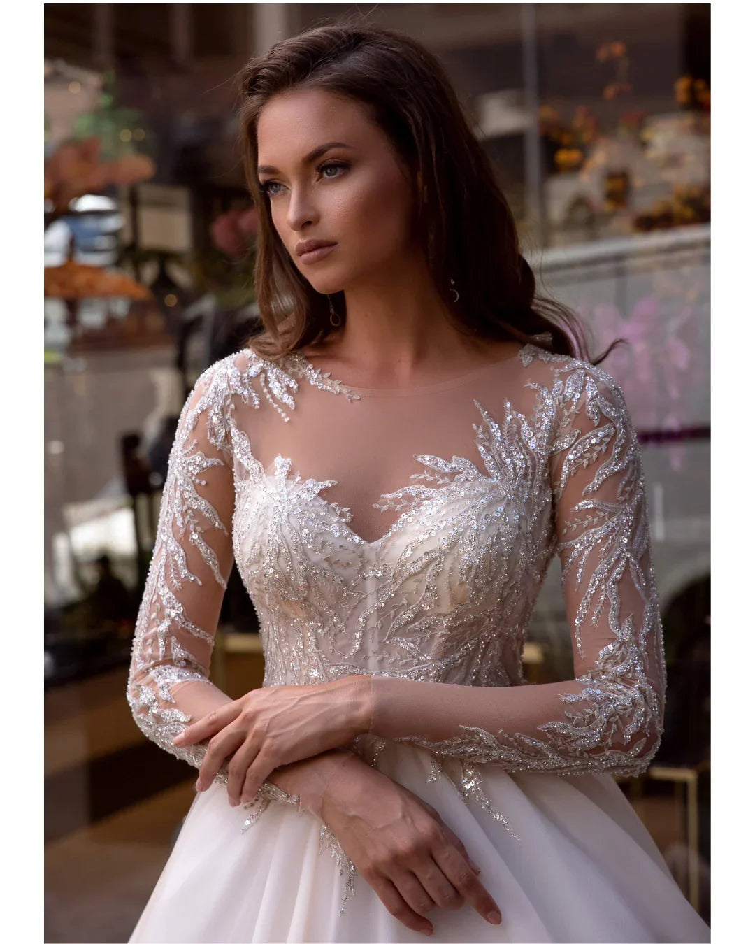 Elegant white wedding dress with beaded lace bodice and flowing ball gown skirt — Mar©a Anette | Endless UAE