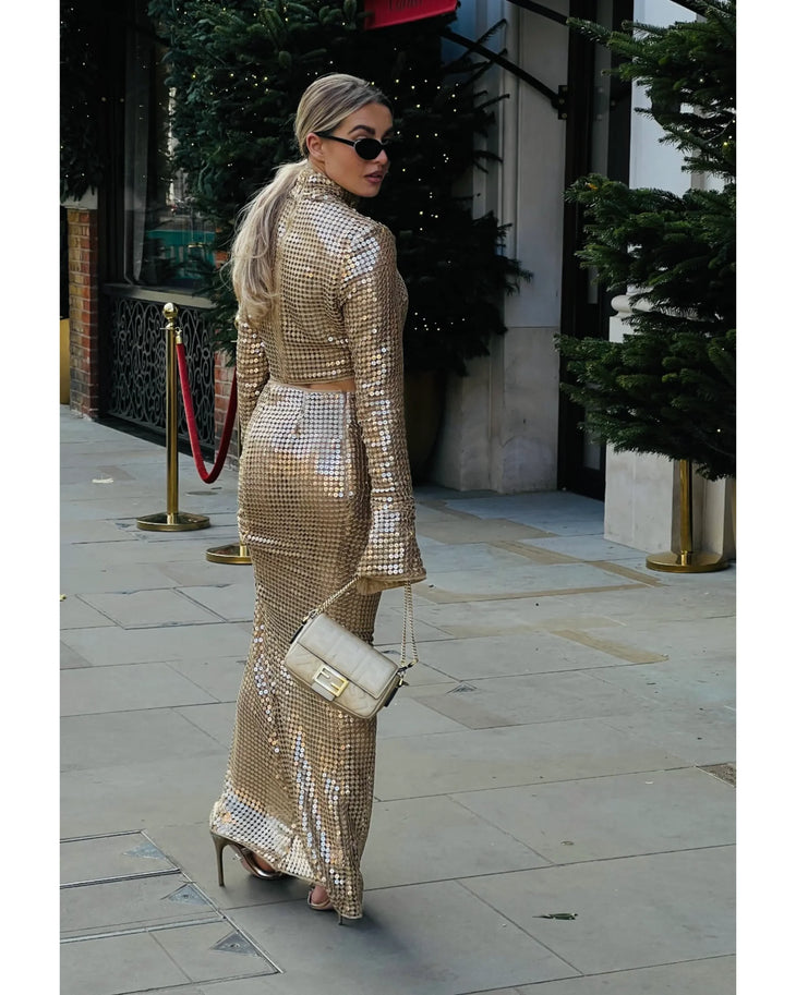 Gold sequined maxi skirt with high waist and cropped top, worn with matching crop top and accessories — Melissa Phair | Endless UAE