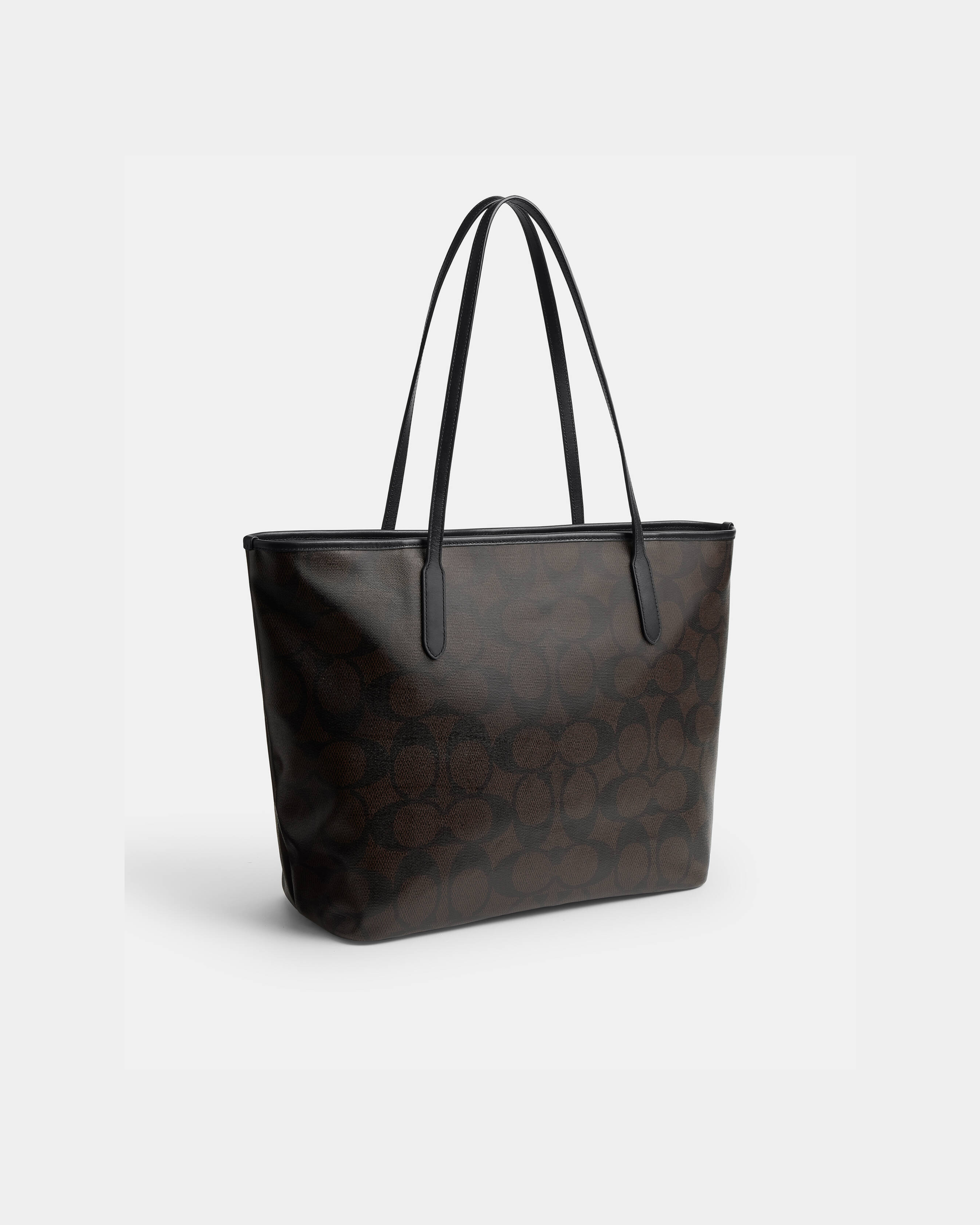 Black leather tote bag with dual handles and Coach branding — Coach | Endless UAE
