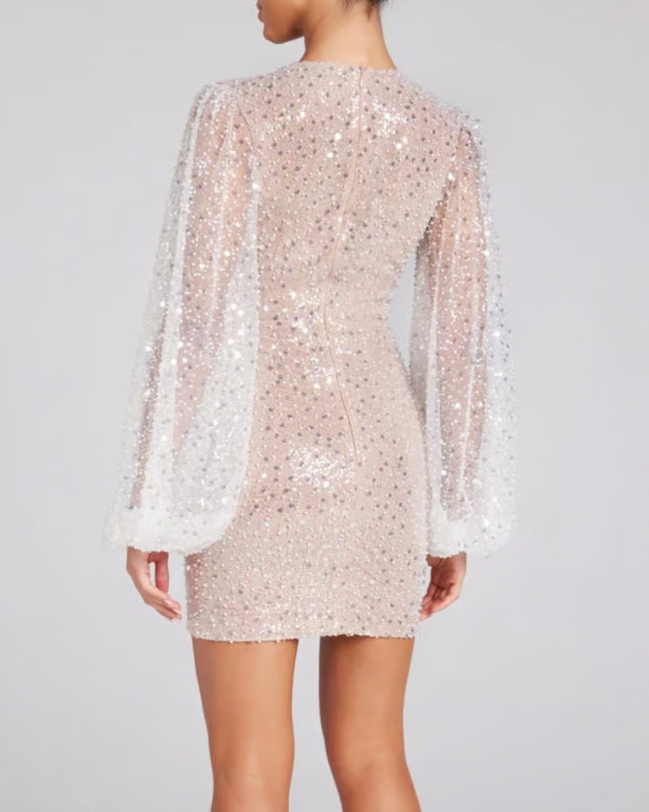 Woman wearing beaded champagne mini dress with draped long sleeves — Nadine Merabi | Endless UAE