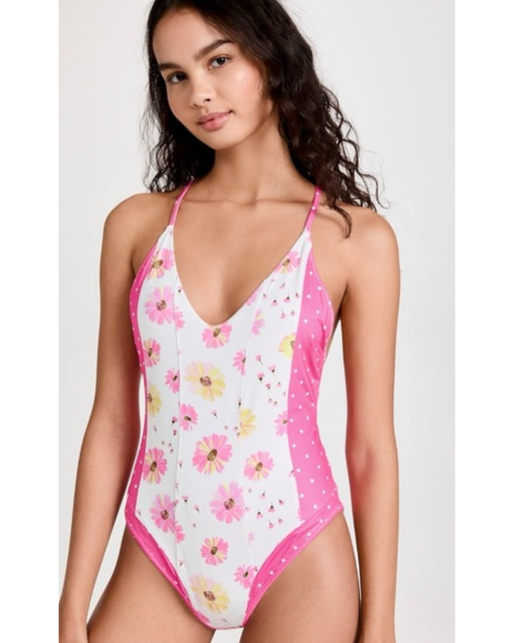 Pink floral one-piece swimsuit with white polka dot side panels and halter neck straps — LoveShackFancy | Endless UAE