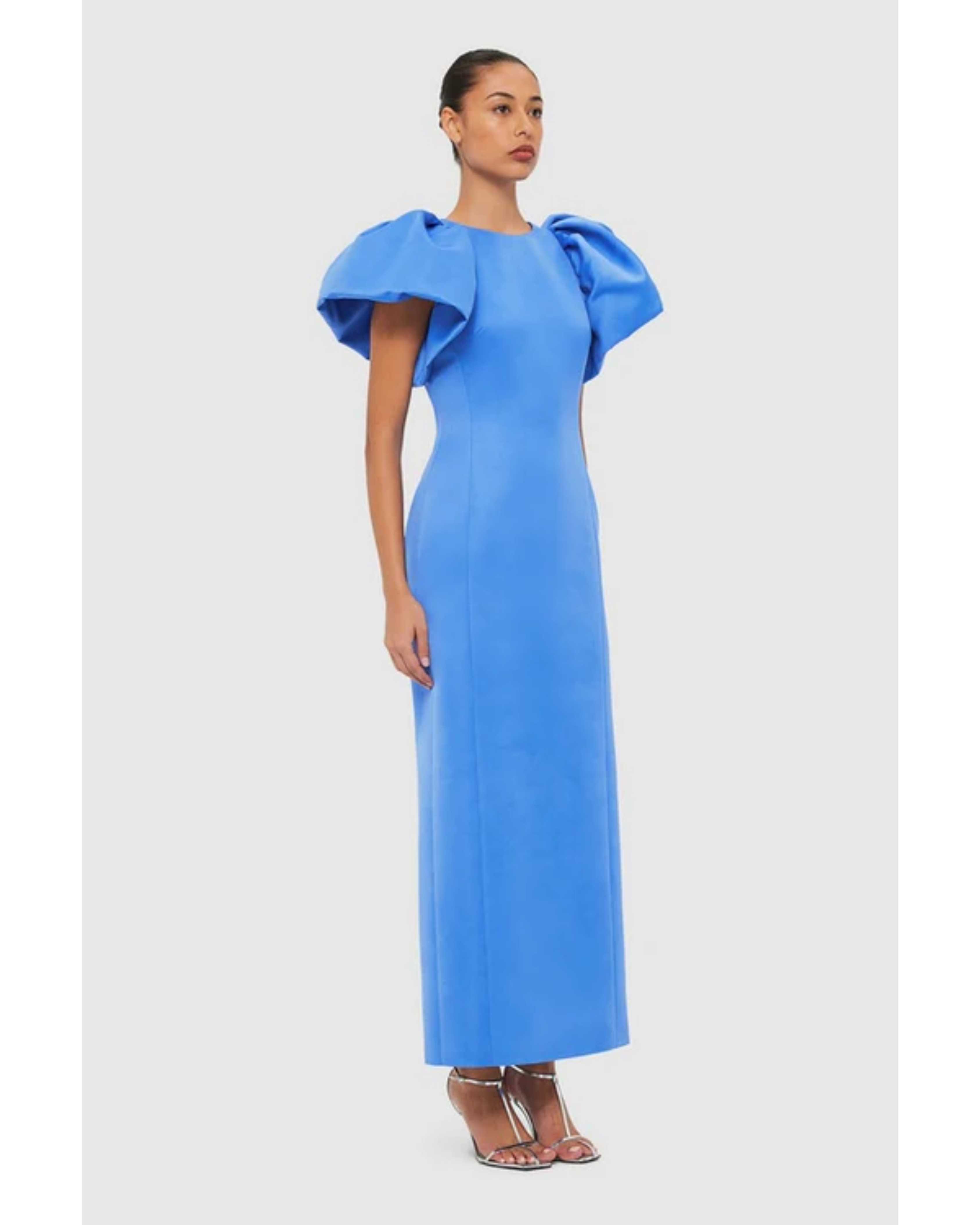 Woman wearing steel blue Lucinda Maxi Dress with puffed sleeves, viewed from back — Leo Lin | Endless UAE