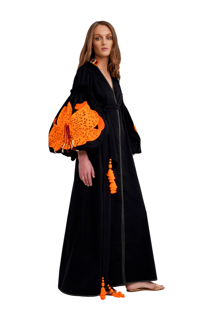 Black cotton maxi caftan with vibrant orange lily embroidered sleeves and tassel details — Yuliya Magdych | Endless UAE