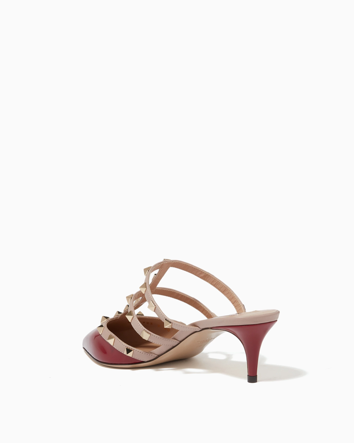 Rockstud Mules in red and beige leather with signature pyramid studs — Valentino Garavani | Endless UAE