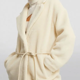 Cream faux fur long coat styled with cream cutout top, black cropped pants and black heels — Anine Bing | Endless UAE