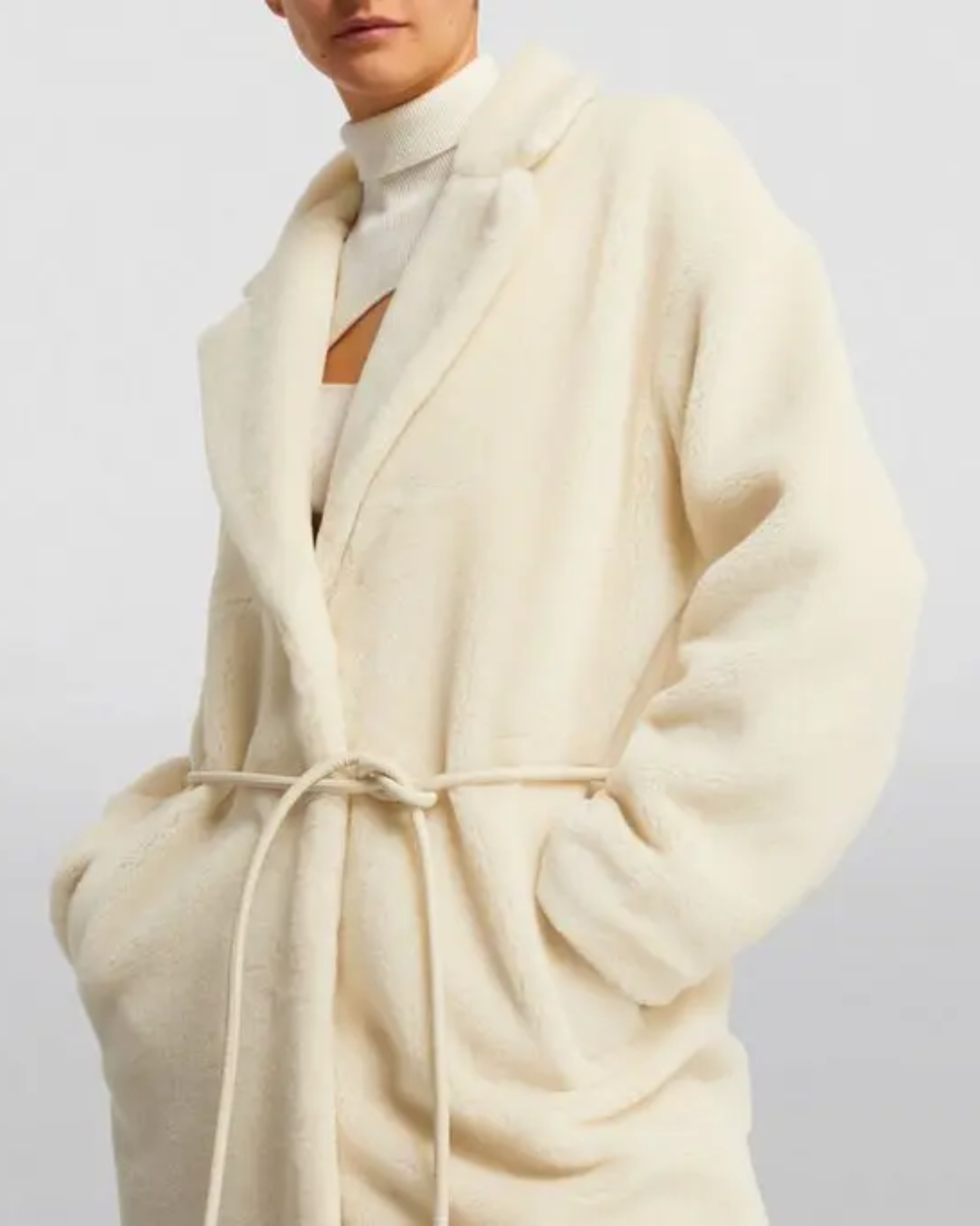 Cream faux fur long coat styled with cream cutout top, black cropped pants and black heels — Anine Bing | Endless UAE