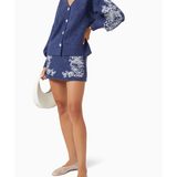 Navy blue knit cardigan with white floral embroidery on sleeves and hem, featuring button-front closure — Aston Studio | Endless UAE