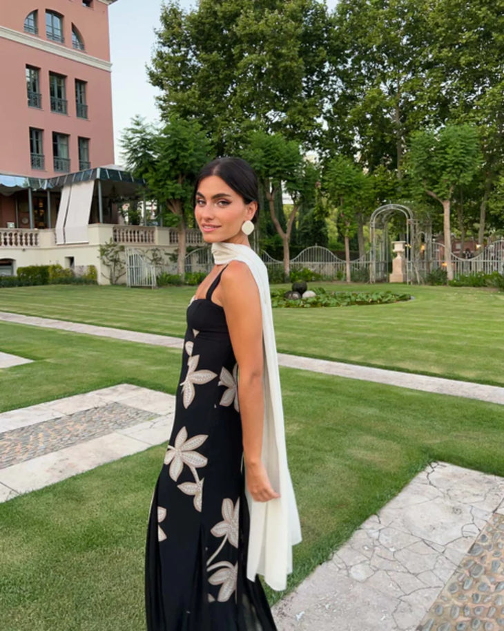 Woman wearing black Salima dress with white leaf embroidery and white shawl — Lady Pipa | Endless UAE