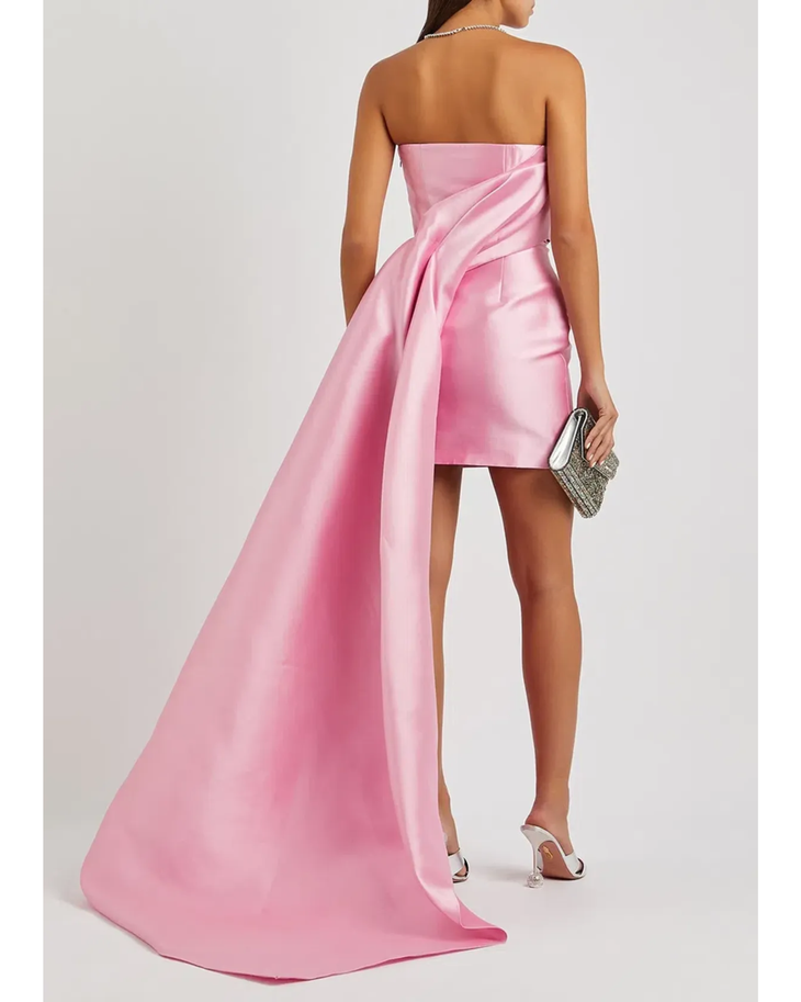 Pink strapless mini dress with dramatic draped overskirt train in lustrous satin fabric — Solace London | Endless UAE