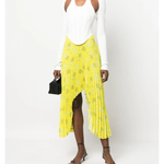 Yellow pleated floral midi skirt with asymmetric hem paired with white tank top and cardigan — Rokh | Endless UAE