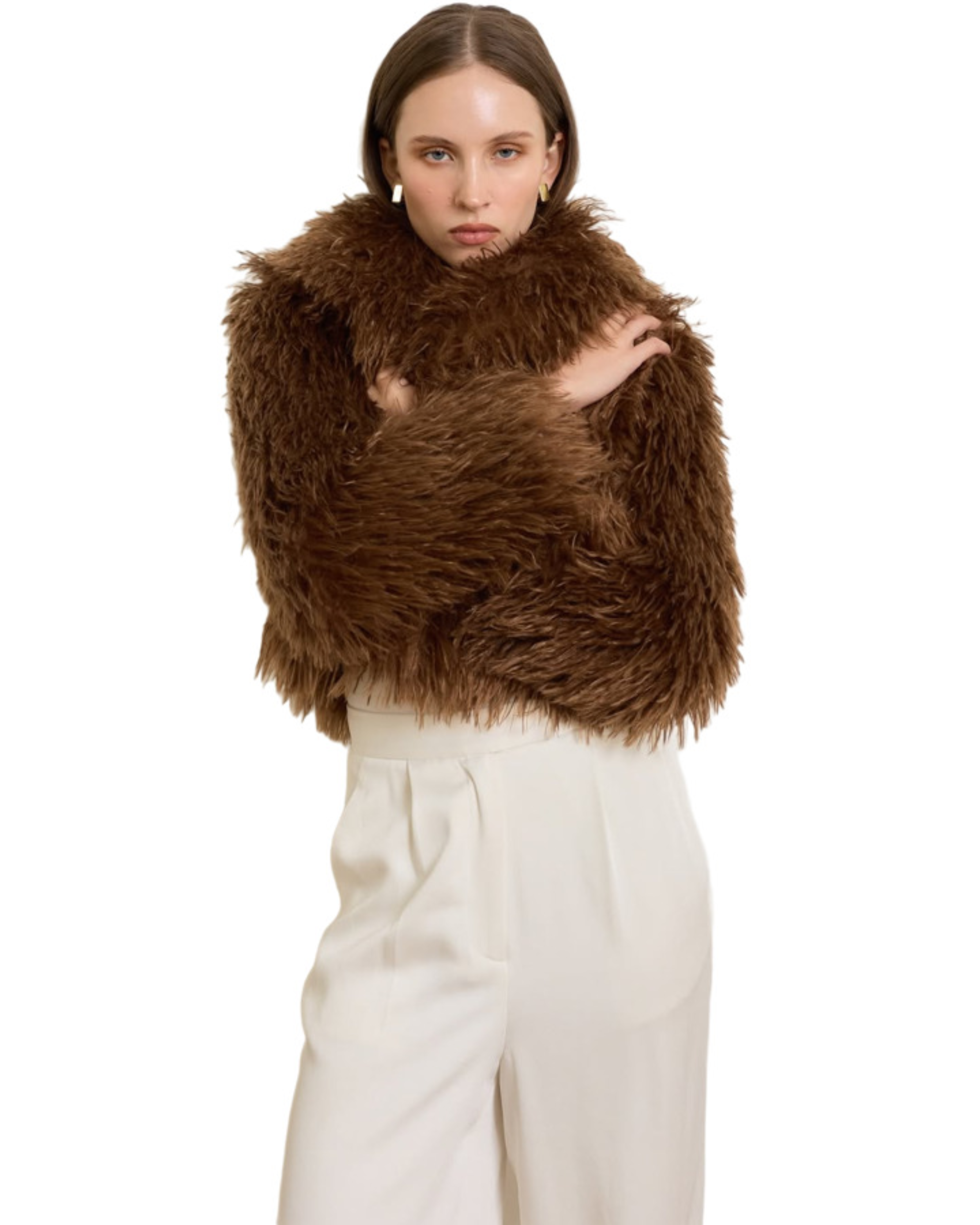 Woman wearing camel-colored fur stole jacket over cream top and pants with burgundy shoes — Madame Magdalena | Endless UAE