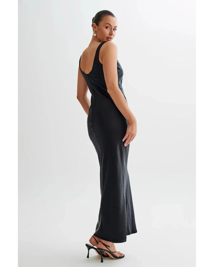 Woman wearing black satin maxi dress with keyhole neckline and tie detail — Meshki | Endless UAE