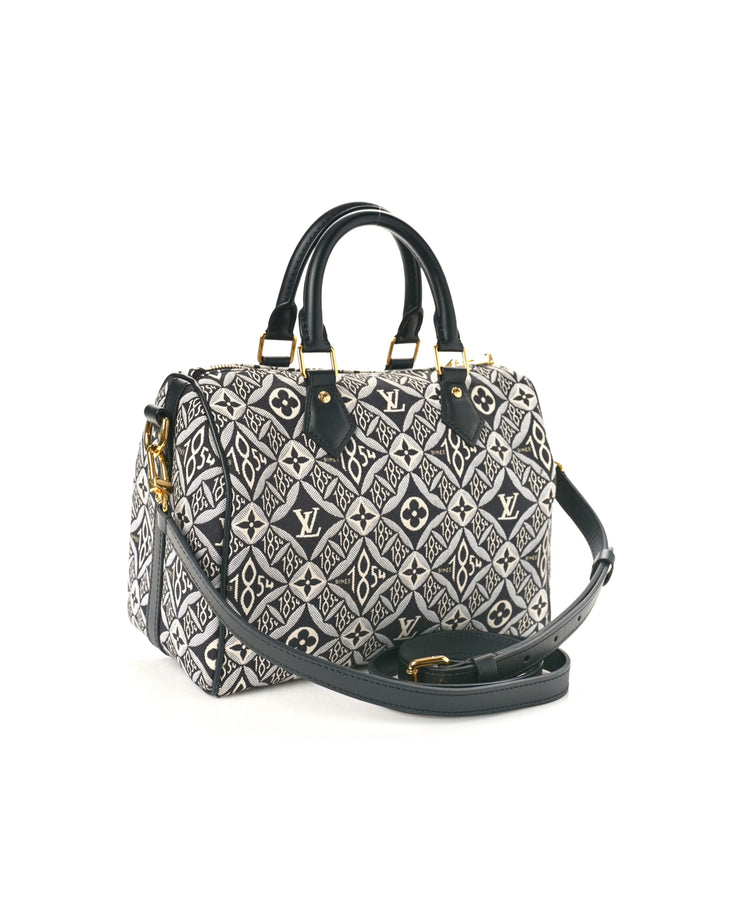 Louis Vuitton Since 1854 Speedy Bandouliere 25 handbag in black and white monogram jacquard with leather handles — Louis Vuitton | Endless UAE