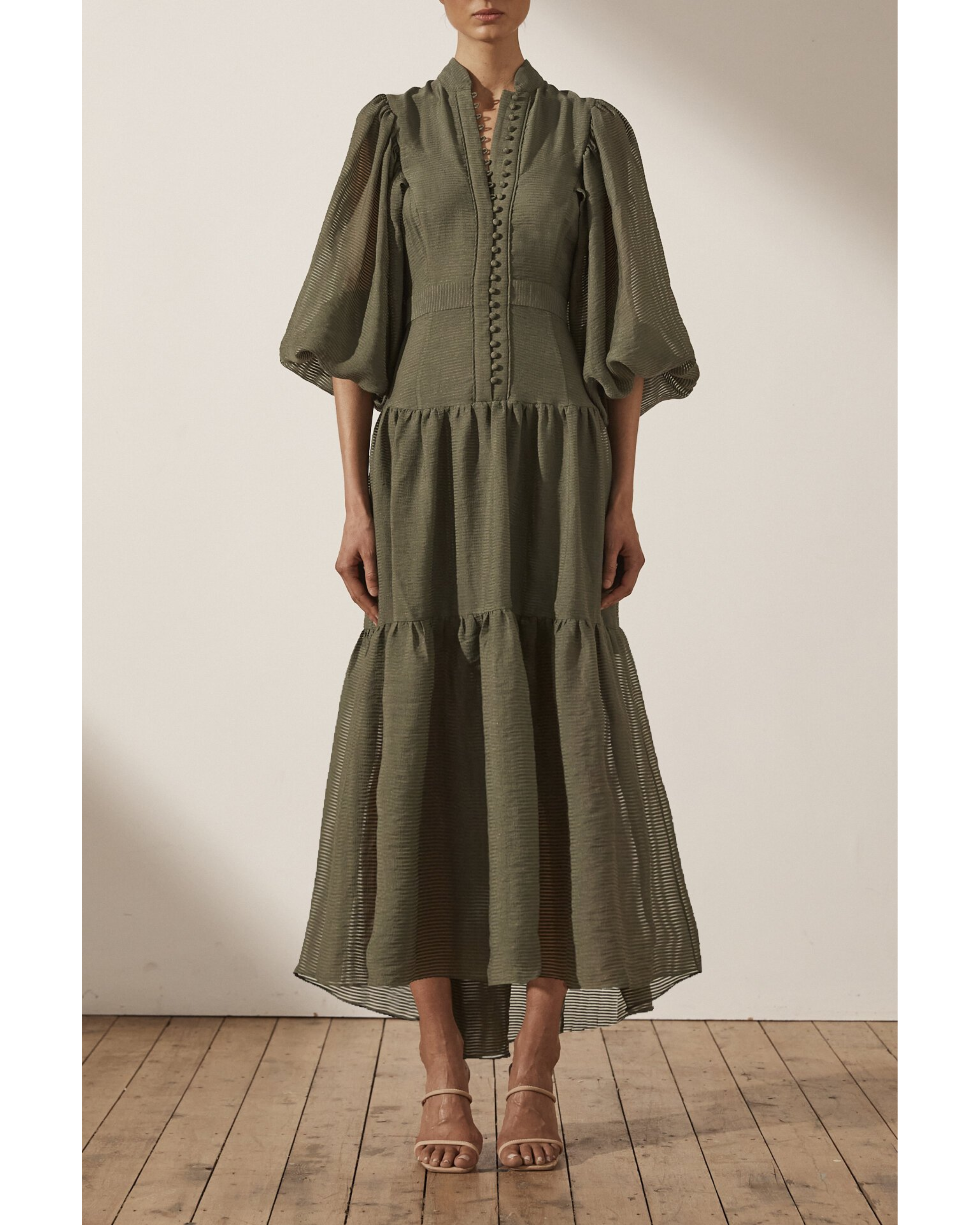 Olive green tiered midi dress with high neck, button front detail, and voluminous three-quarter sleeves — Shona Joy | Endless UAE