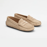 Beige suede junior driving loafer with black rubber sole and stitched detailing — Tod's | Endless UAE