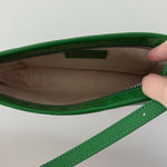 Dulce Patent Leather Shoulder Bag in vibrant green, held up against neutral background — By Far | Endless UAE