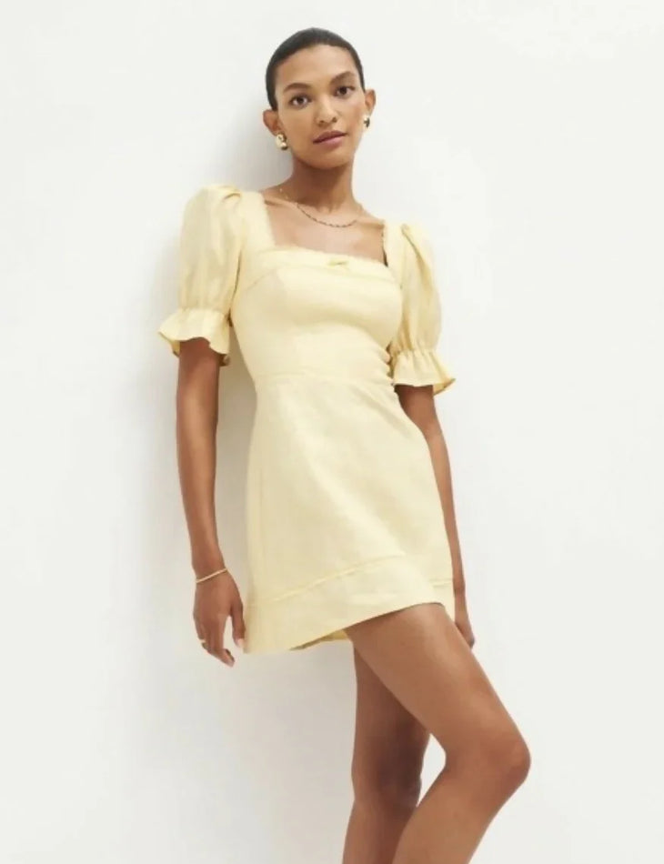 Evianna Linen Dress in pale yellow with square neckline and puff sleeves — Reformation | Endless UAE