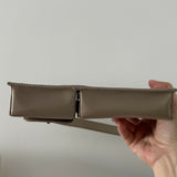 Beige patent leather shoulder bag with dual compartments and silver turnlock closures — Endless | Endless UAE