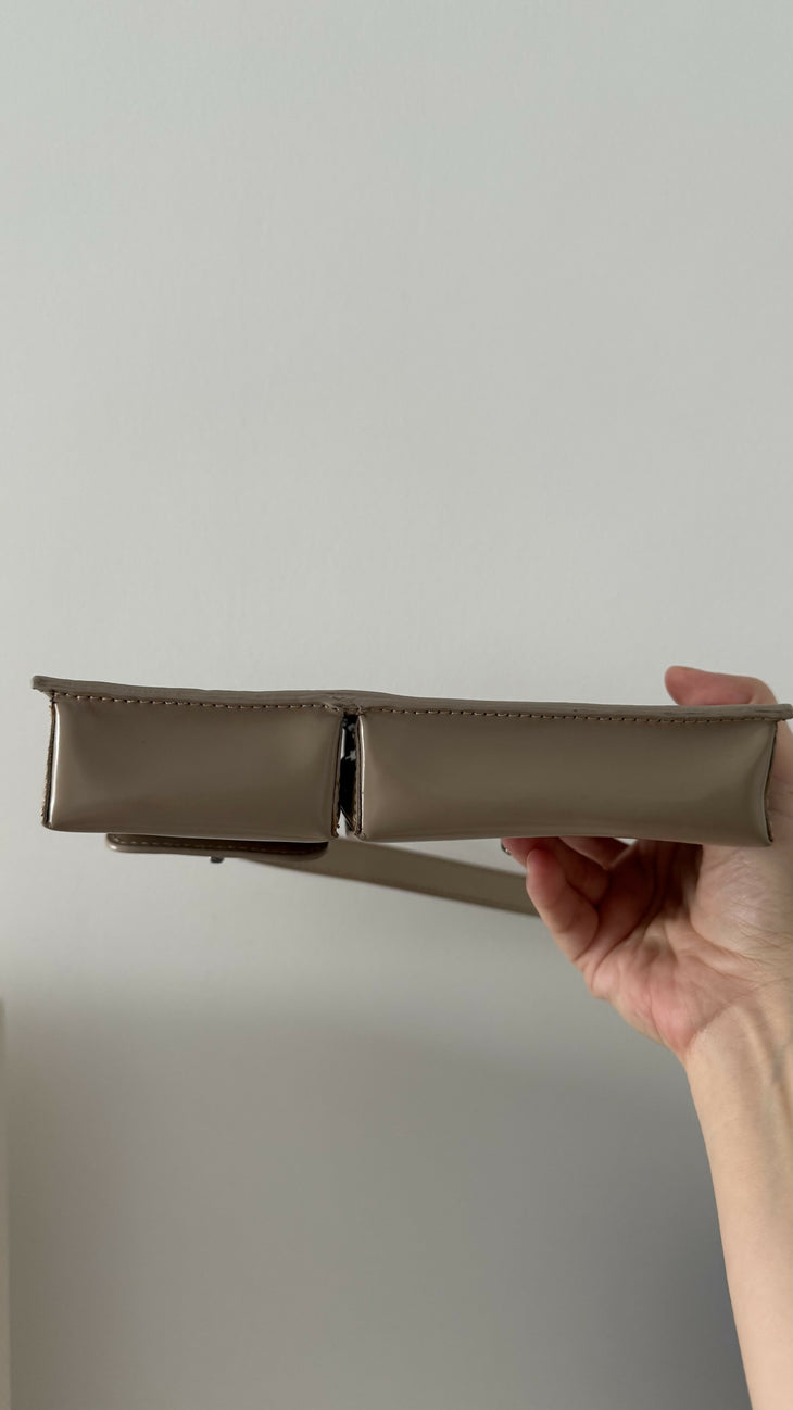 Beige patent leather shoulder bag with dual compartments and silver turnlock closures — Endless | Endless UAE