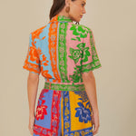 Colorful patchwork romper with mixed floral prints and green trim belt — FARM Rio | Endless UAE