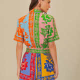 Colorful patchwork romper with mixed floral prints and green trim belt — FARM Rio | Endless UAE