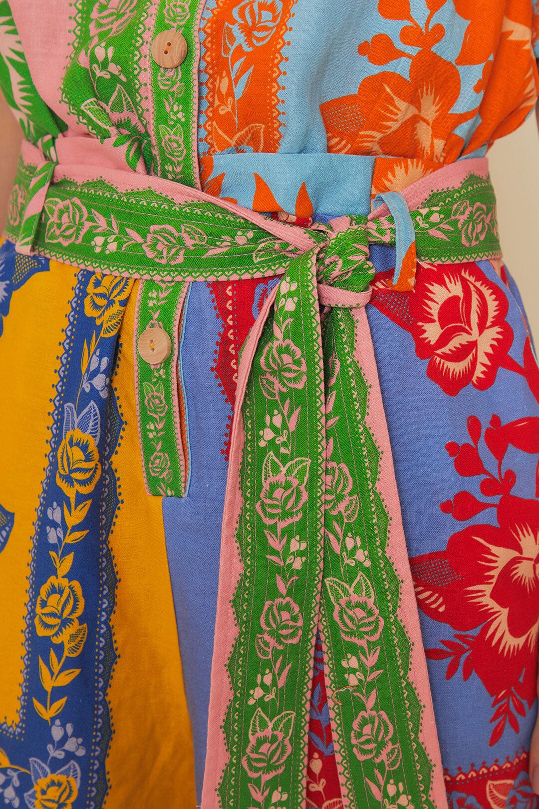 Colorful patchwork romper with mixed floral prints and green trim belt — FARM Rio | Endless UAE