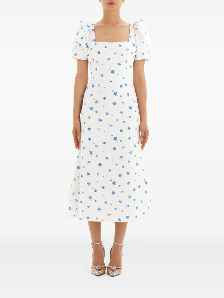 White midi dress with blue floral print, square neckline, short puff sleeves, and A-line silhouette — Post Meridiem | Endless UAE