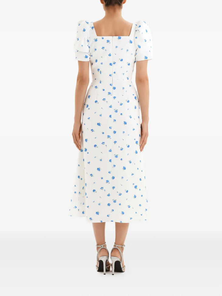 White midi dress with blue floral print, puff sleeves, and square neckline, back view — Post Meridiem | Endless UAE