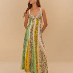 Woman wearing colorful striped maxi dress with floral prints in green, yellow and pink tones — Farm Rio | Endless UAE