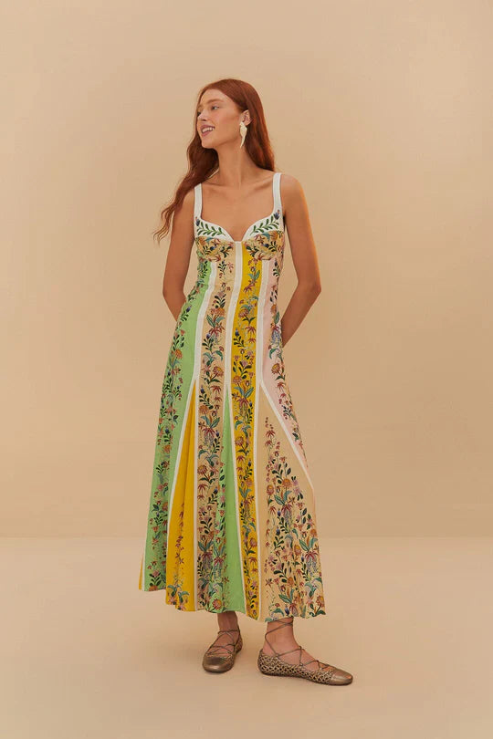 Woman wearing colorful striped maxi dress with floral prints in green, yellow and pink tones — Farm Rio | Endless UAE